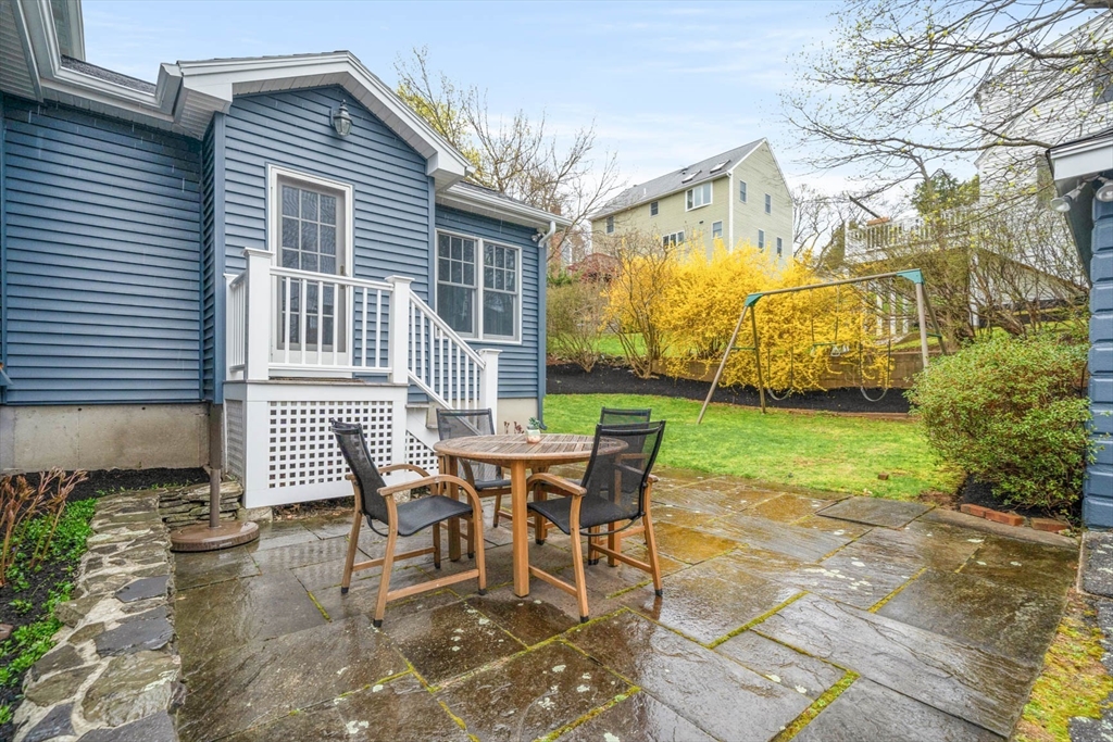 50 Allen Road Winchester, MA 01890 - Photo 27 of 29 a view of a house with backyard and sitting area