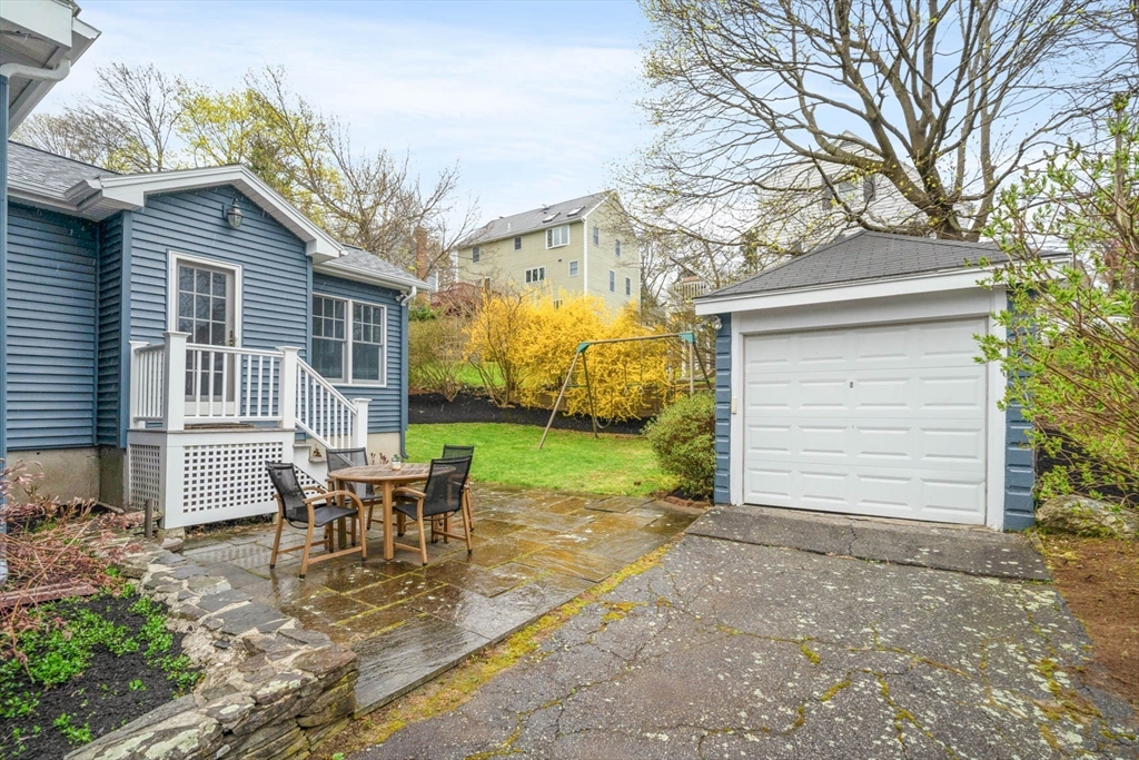 50 Allen Road Winchester, MA 01890 - Photo 28 of 29 a view of a house with backyard and sitting area