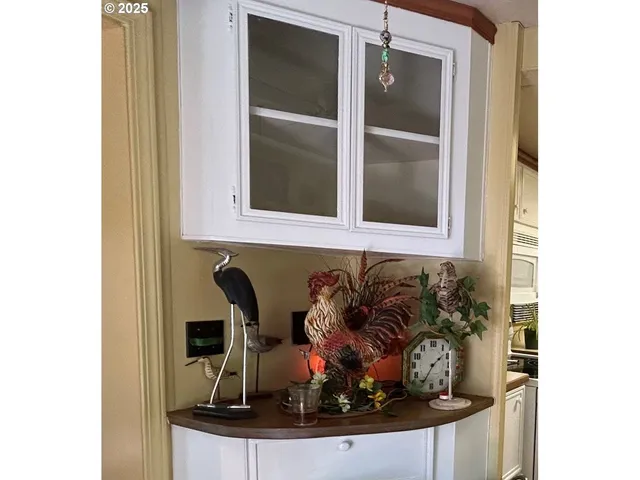 a kitchen with cabinets stainless steel appliances and sink