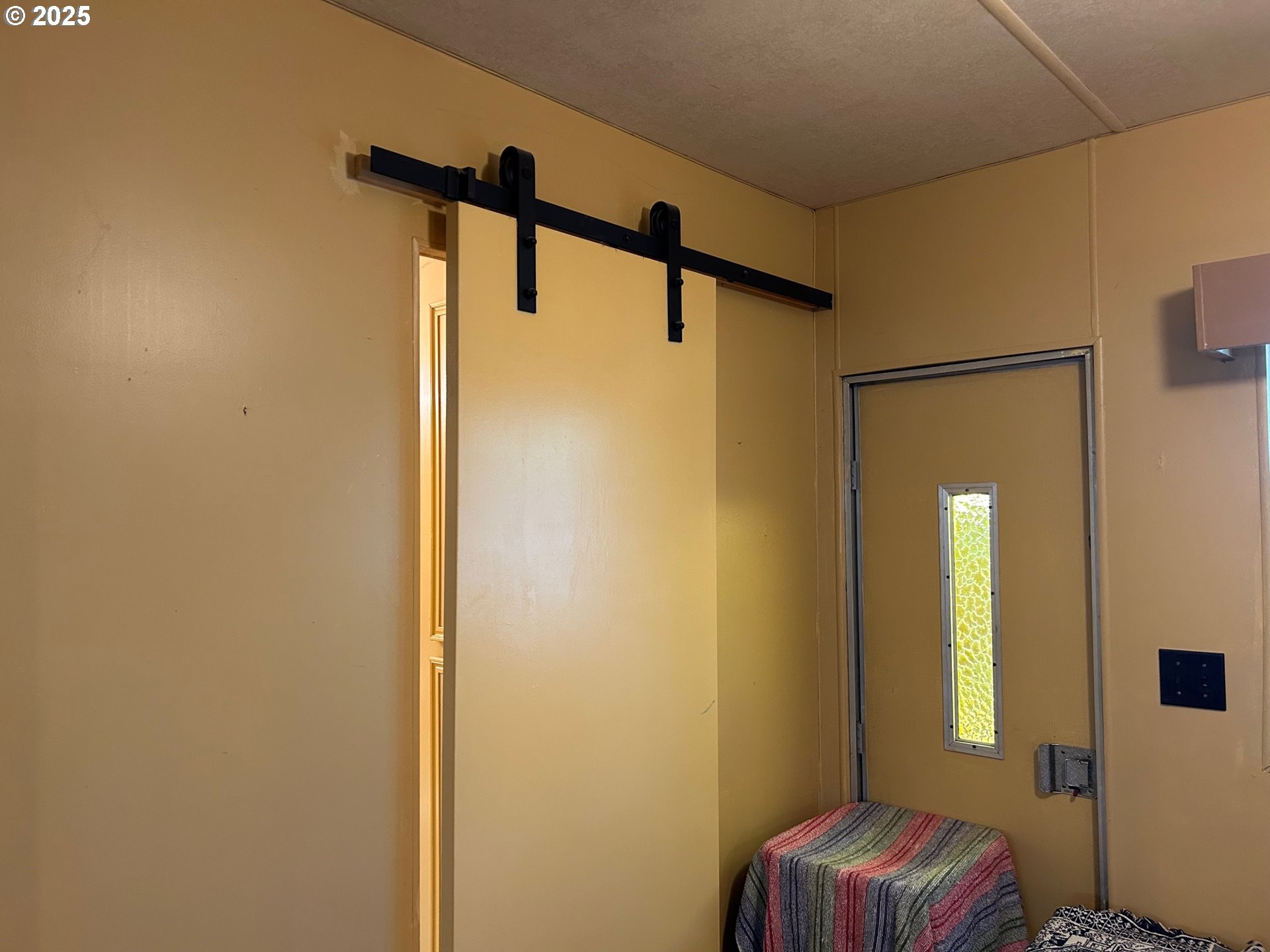 238 Horseshoe Bend Florence, OR 97439 - Photo 24 of 26 a bedroom with a bed and a window