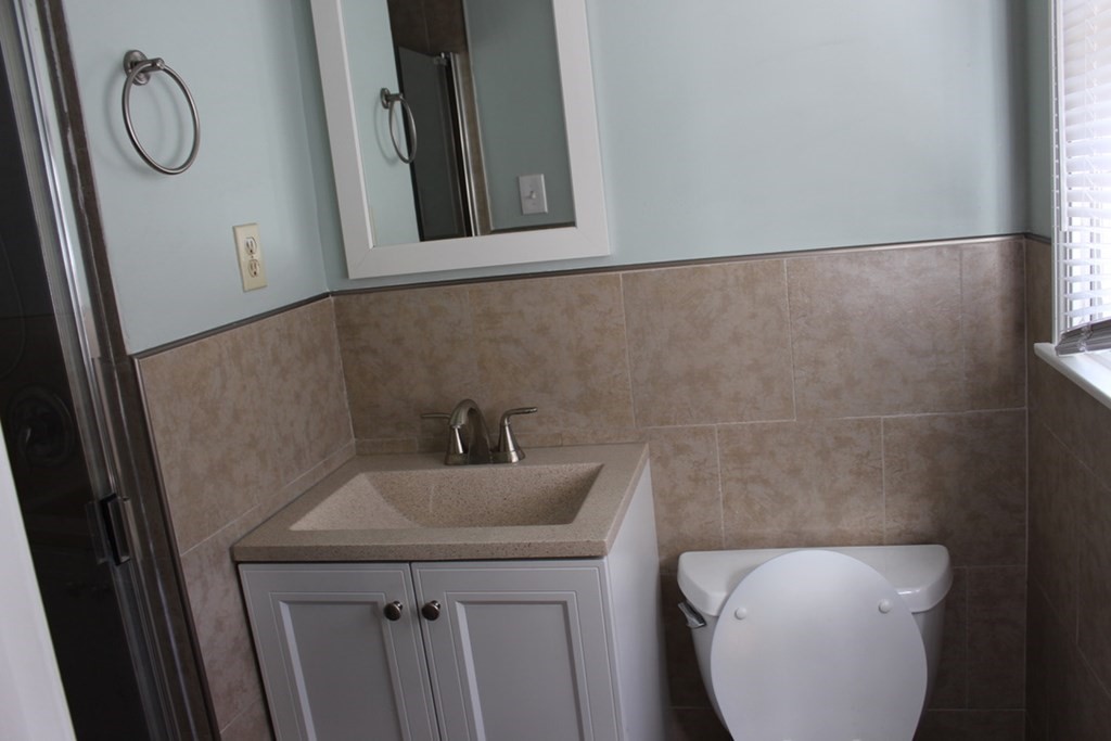 116 Victoria Road Sudbury, MA 01776 - Photo 25 of 38 a bathroom with a toilet and sink