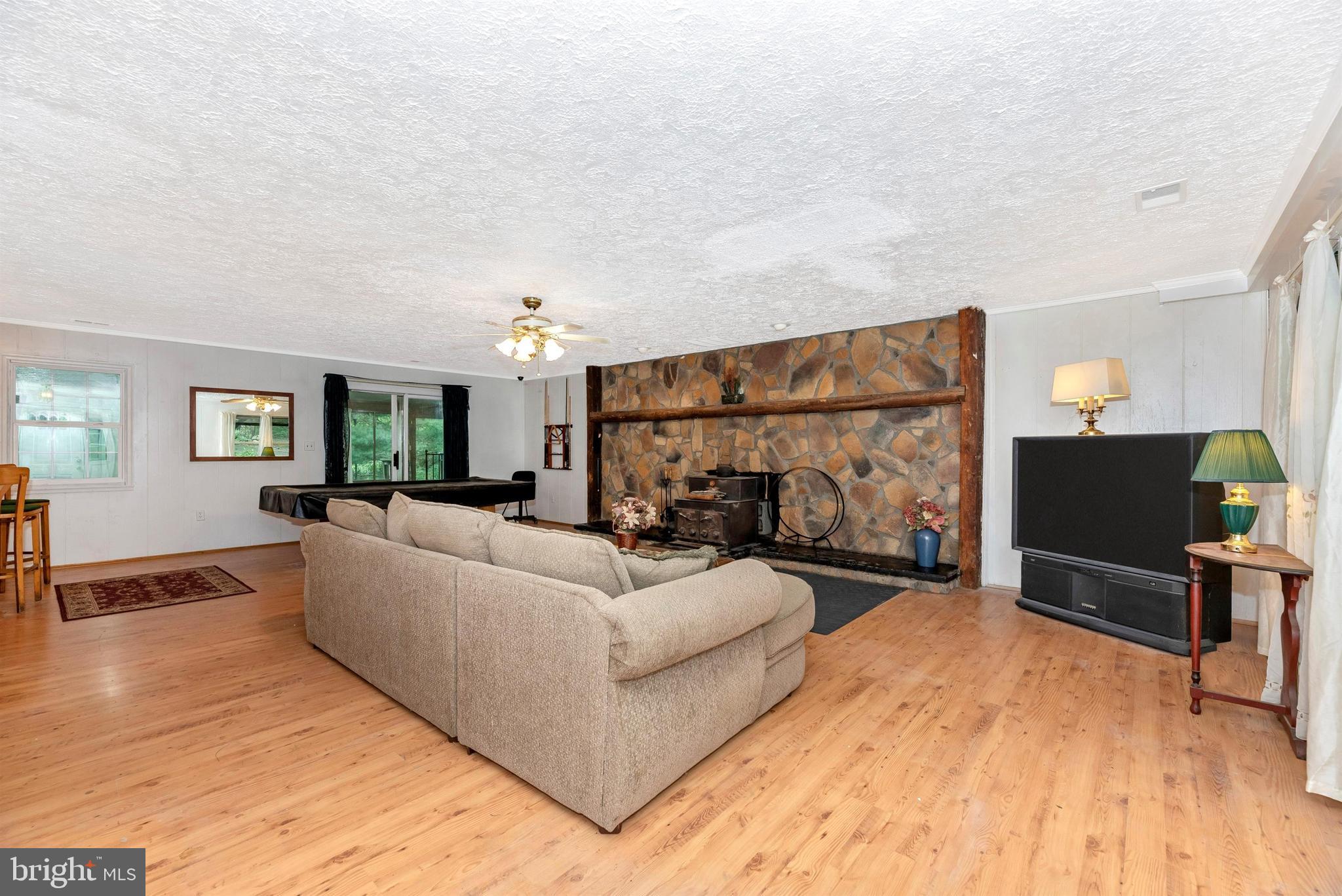 14106 Harrisville Road Mount Airy, MD 21771 - Photo 7 of 55 Great Room has Stone Hearth Fireplace