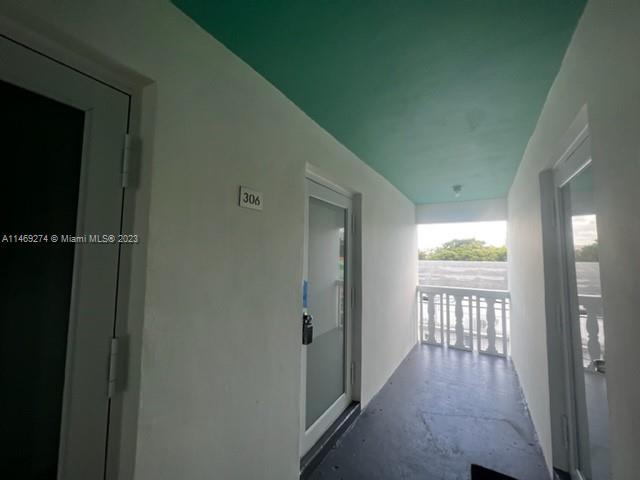 1857 Jefferson Street, Unit 306 Hollywood, FL 33020 - Photo 11 of 23 a view of hallway with windows