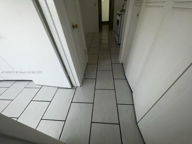 1857 Jefferson Street, Unit 306 Hollywood, FL 33020 - Photo 13 of 23 a view of an empty walk in closet