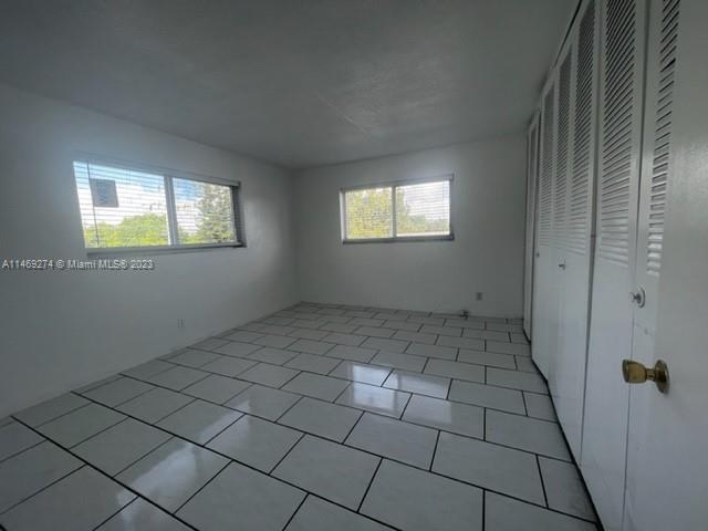 1857 Jefferson Street, Unit 306 Hollywood, FL 33020 - Photo 16 of 23 an empty room with windows