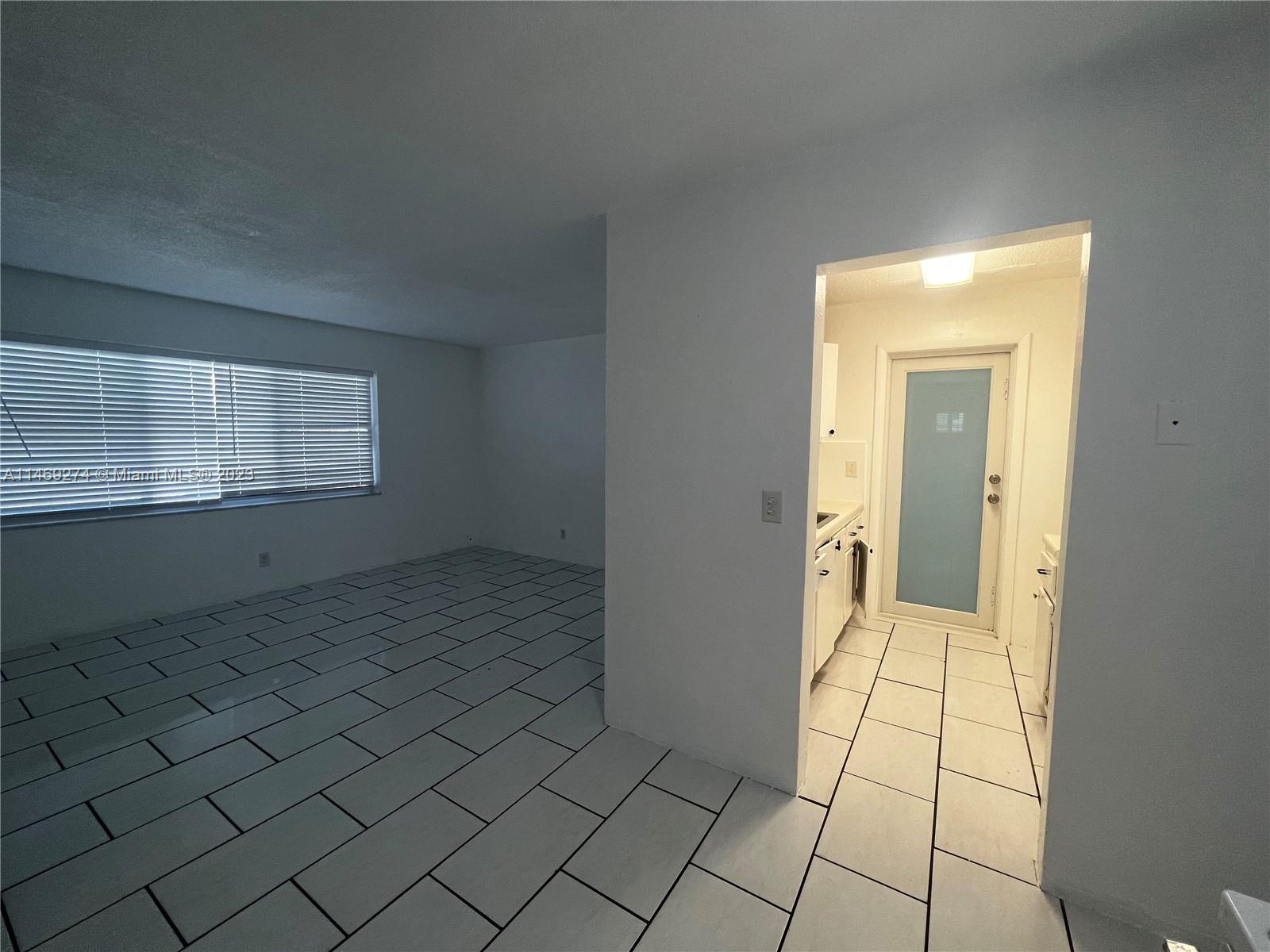 1857 Jefferson Street, Unit 306 Hollywood, FL 33020 - Photo 2 of 23 a view of an empty room and window