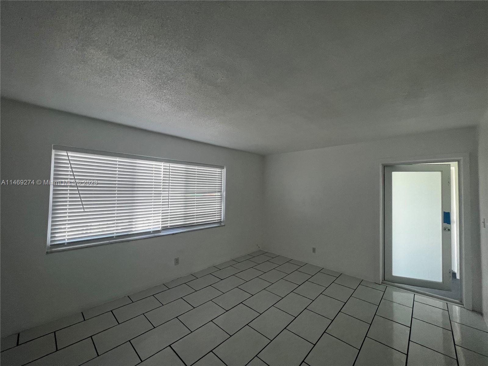 1857 Jefferson Street, Unit 306 Hollywood, FL 33020 - Photo 5 of 23 a view of an empty room and window