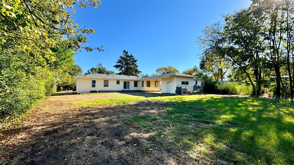 105 Davidson Drive Terrell, TX 75160 - Photo 20 of 21 a front view of a house with a yard