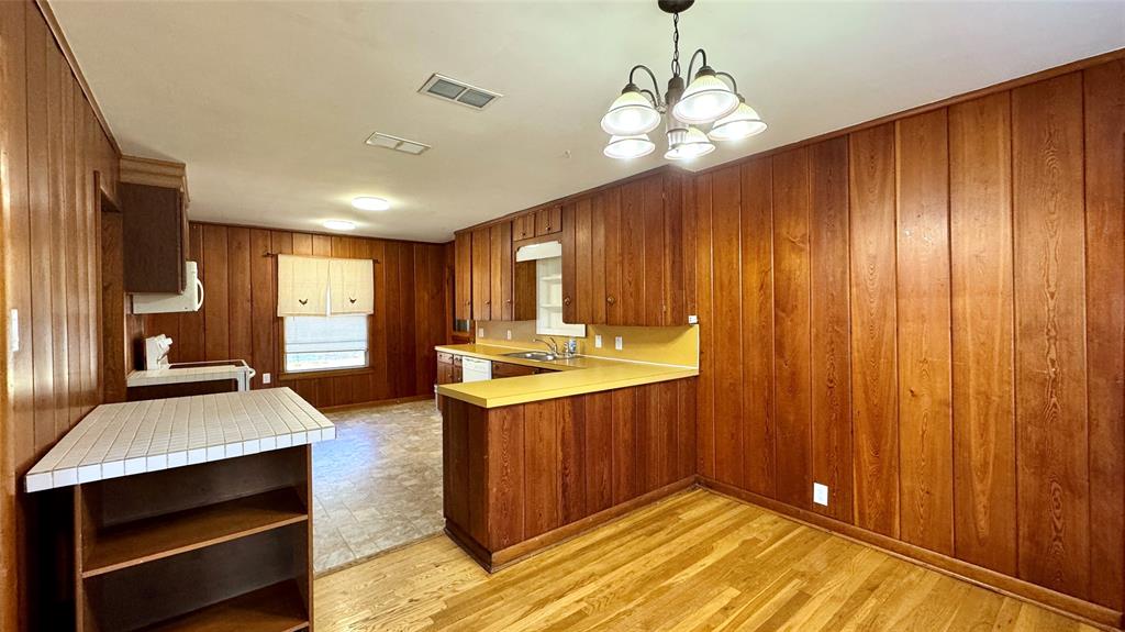 105 Davidson Drive Terrell, TX 75160 - Photo 5 of 21 a view of kitchen with sink microwave and refrigerator
