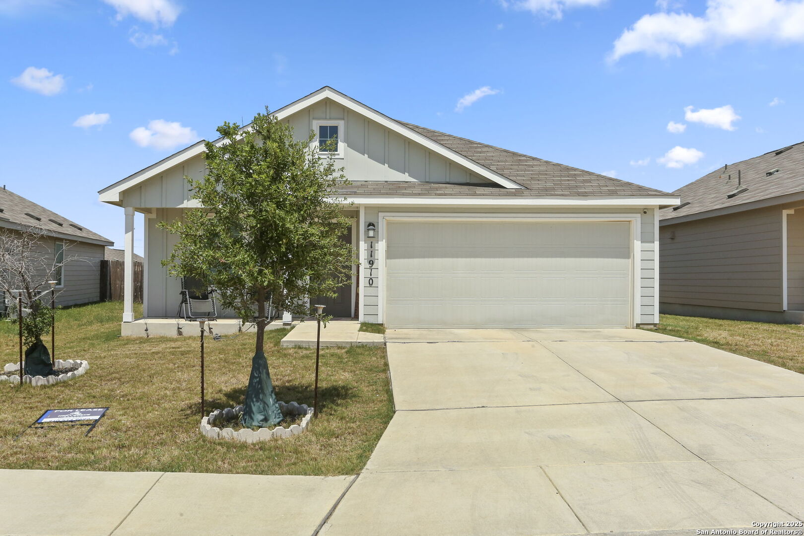 11910 Pewee San Antonio, TX 78221 - Photo 1 of 18 a front view of a house with garden