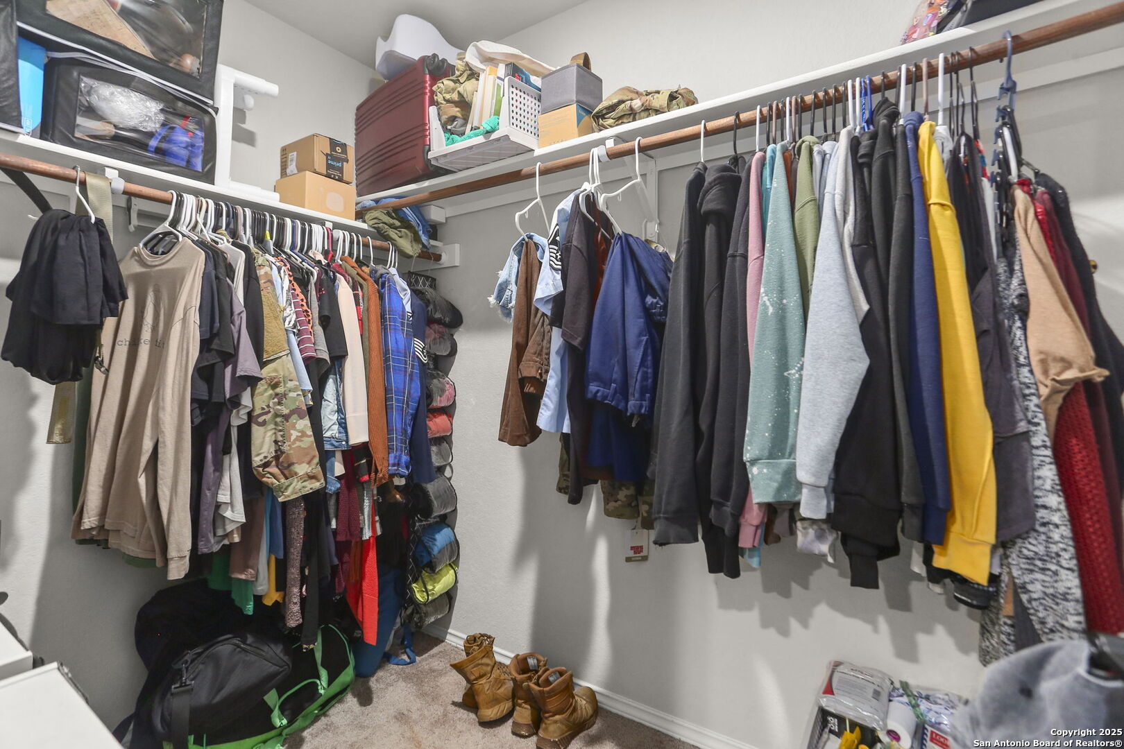 11910 Pewee San Antonio, TX 78221 - Photo 12 of 18 a view of walk in closet with clothes