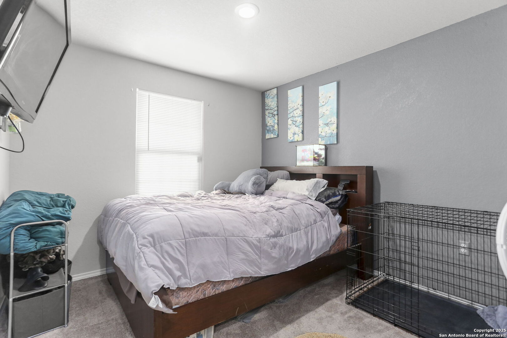 11910 Pewee San Antonio, TX 78221 - Photo 14 of 18 a bedroom with a bed and window