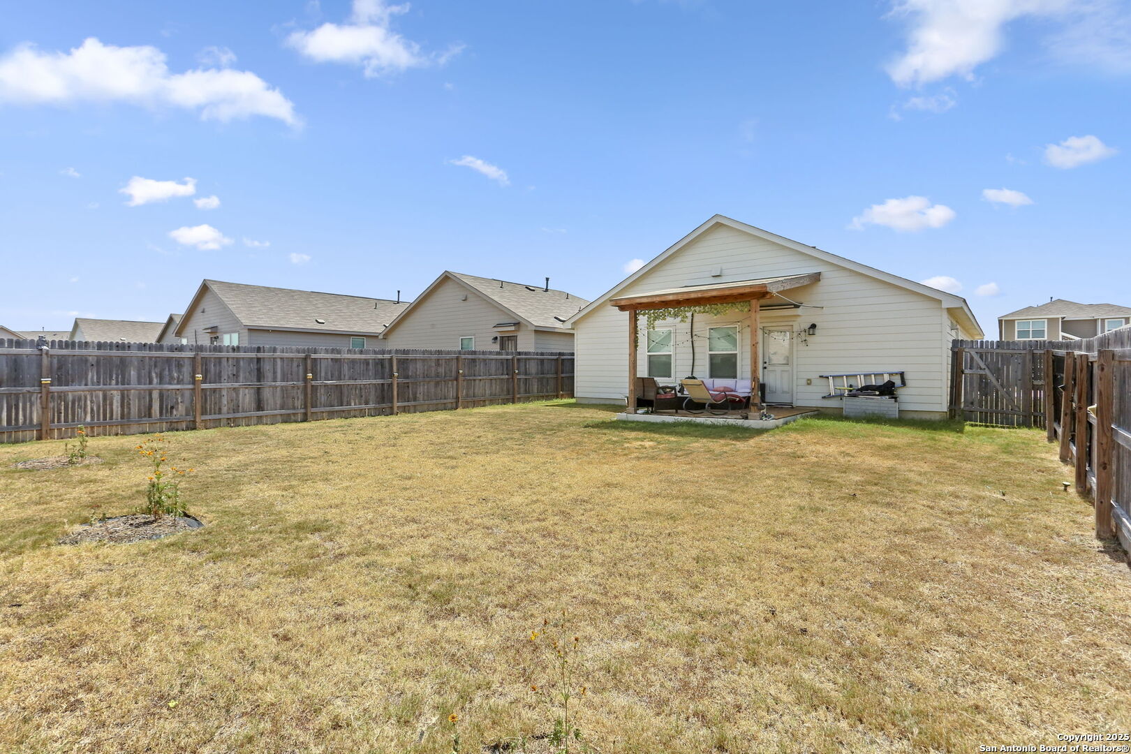 11910 Pewee San Antonio, TX 78221 - Photo 17 of 18 a front view of a house with a yard