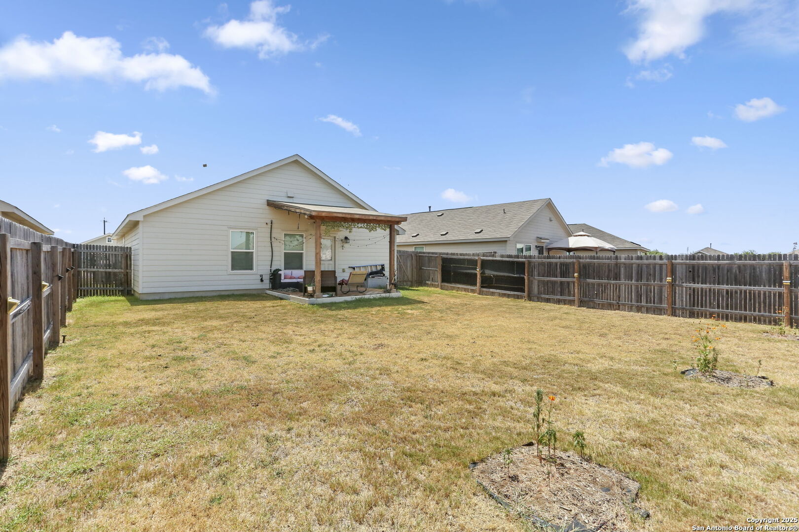 11910 Pewee San Antonio, TX 78221 - Photo 18 of 18 a house view with a outdoor space
