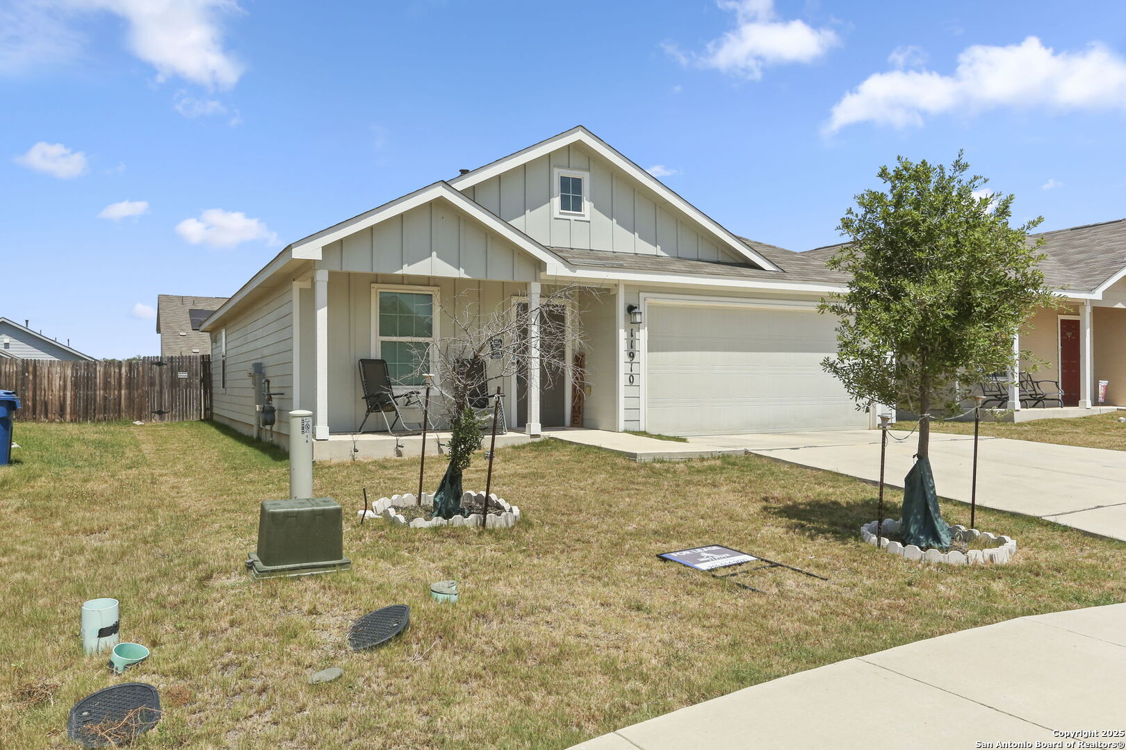 11910 Pewee San Antonio, TX 78221 - Photo 2 of 18 a front view of a house with a yard
