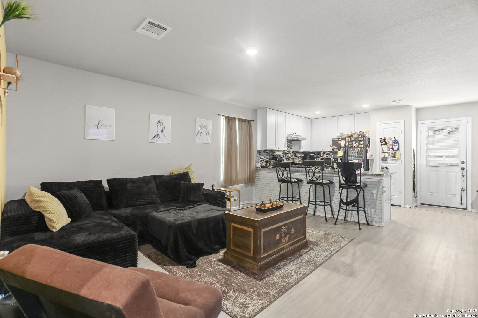 11910 Pewee San Antonio, TX 78221 - Photo 5 of 18 a living room with furniture and a table