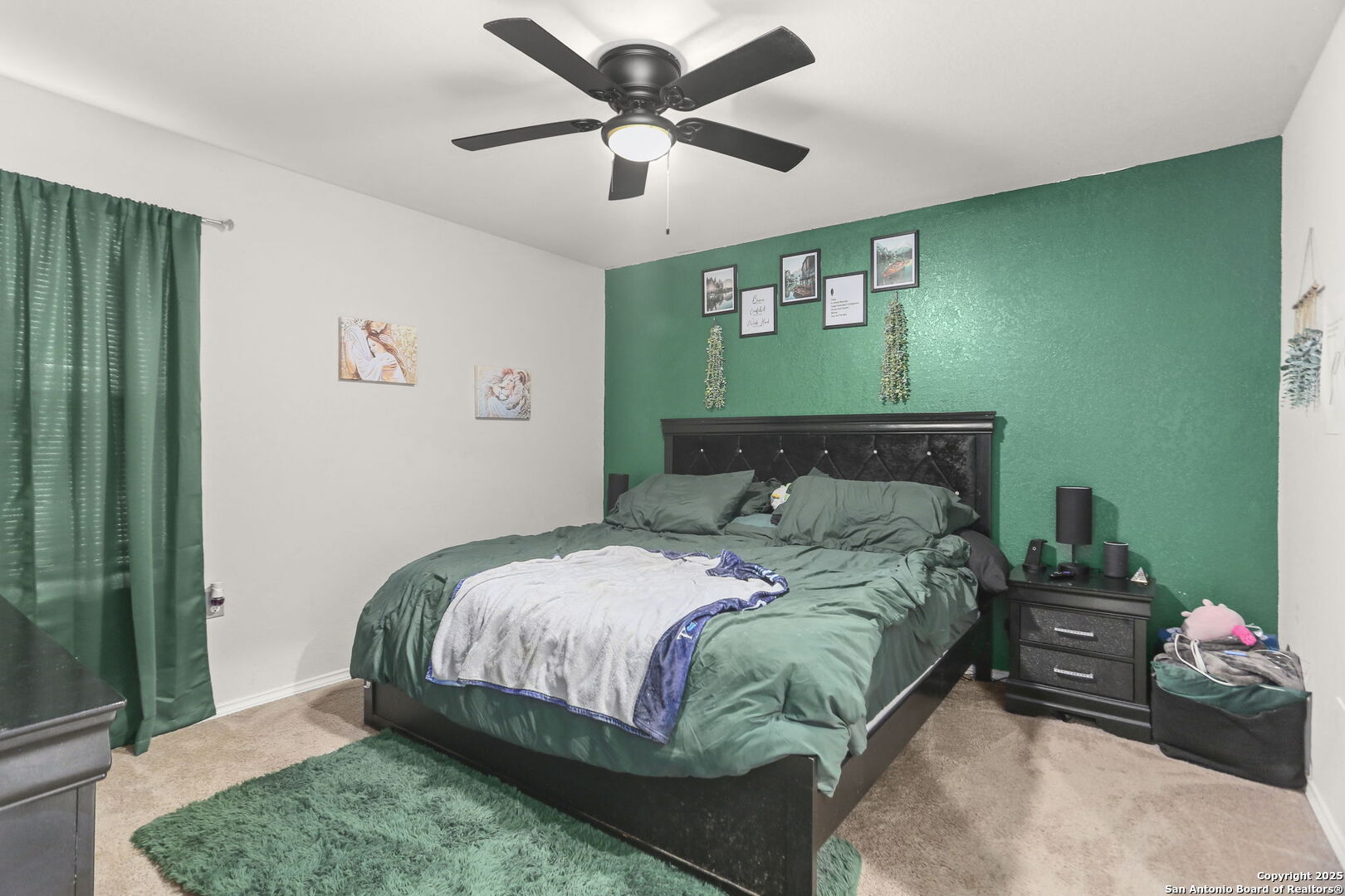 11910 Pewee San Antonio, TX 78221 - Photo 9 of 18 a bedroom with a bed mirror and a window