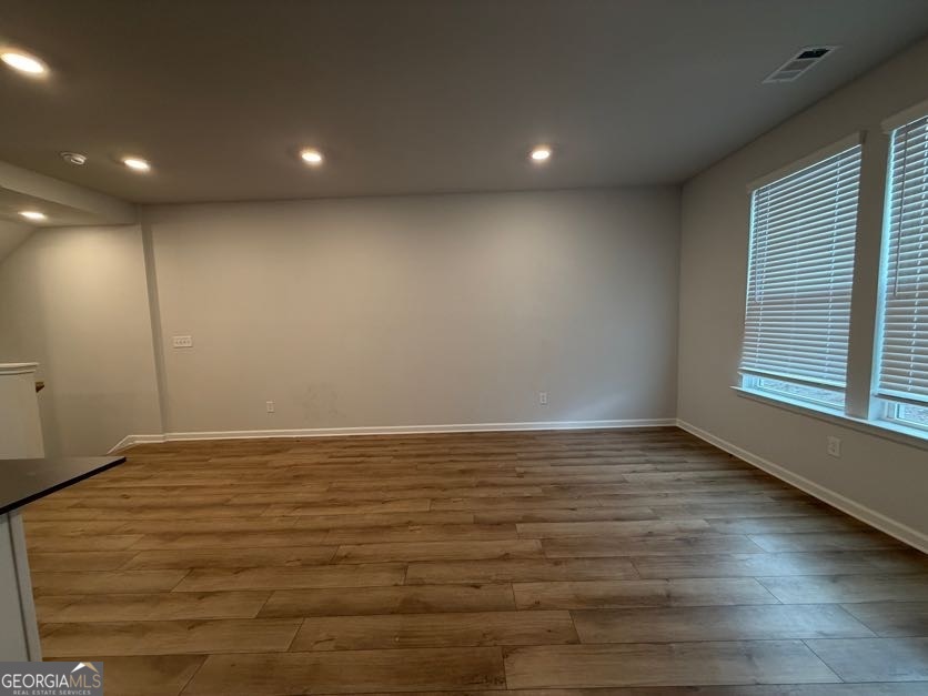 822 Werner Brook Way Southwest Atlanta, GA 30354 - Photo 13 of 55 a view of an empty room with wooden floor and a window