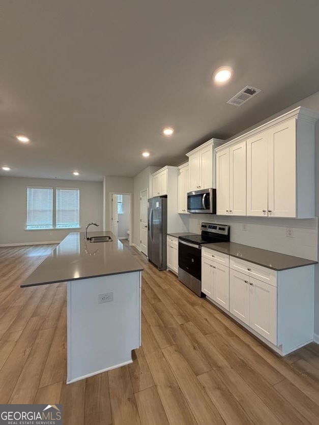 822 Werner Brook Way Southwest Atlanta, GA 30354 - Photo 20 of 55 a large kitchen with stainless steel appliances kitchen island a large counter top and a sink