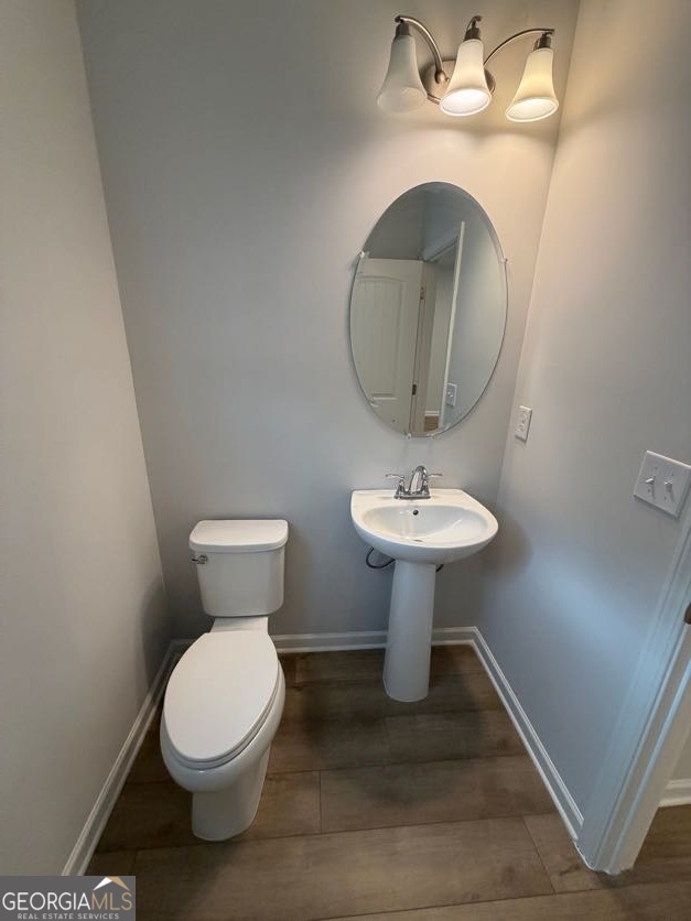 822 Werner Brook Way Southwest Atlanta, GA 30354 - Photo 26 of 55 a bathroom with a toilet sink and a mirror