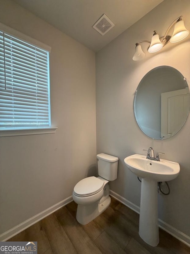 822 Werner Brook Way Southwest Atlanta, GA 30354 - Photo 27 of 55 a bathroom with a toilet sink and mirror