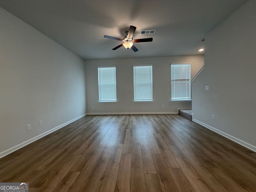 822 Werner Brook Way Southwest Atlanta, GA 30354 - Photo 30 of 55 a view of empty room with wooden floor and fan
