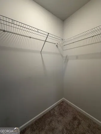 a bathroom with a double vanity sink and mirror with shower
