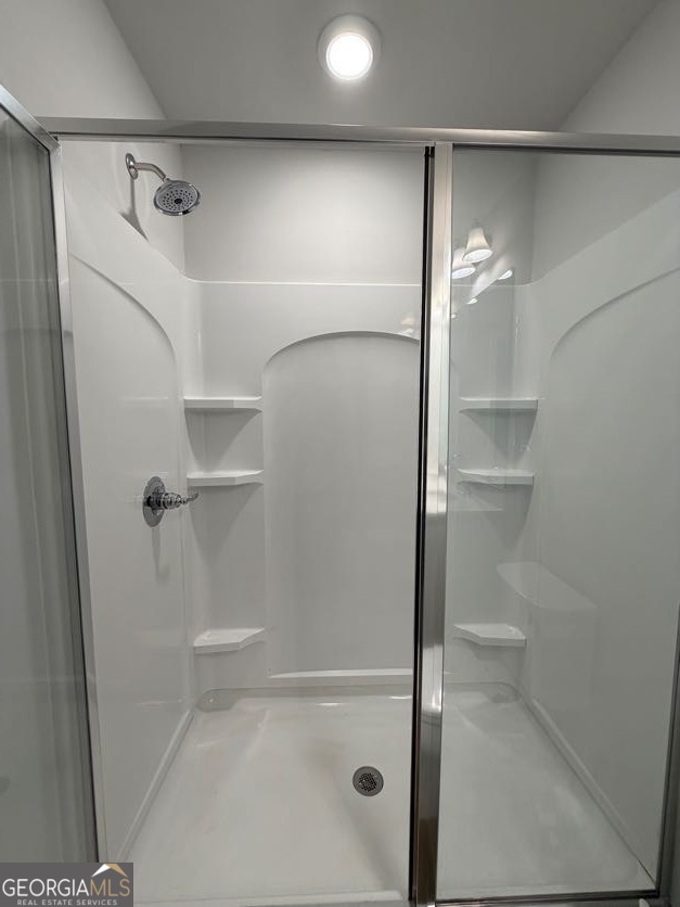 822 Werner Brook Way Southwest Atlanta, GA 30354 - Photo 41 of 55 a bathroom with a glass shower door