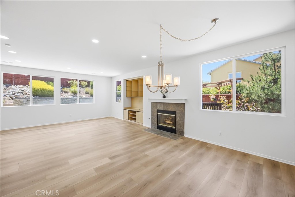 8710 Windmill Place Riverside, CA 92508 - Photo 27 of 66 a view of an empty room with a window and fireplace