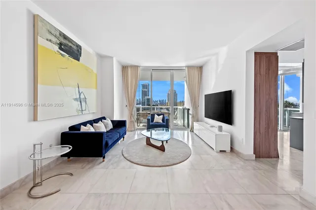 a living room with furniture and a flat screen tv