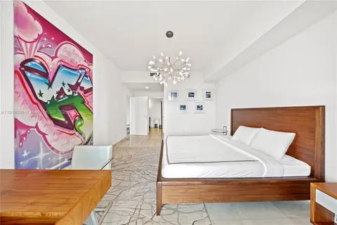 a bedroom with a bed and a couch