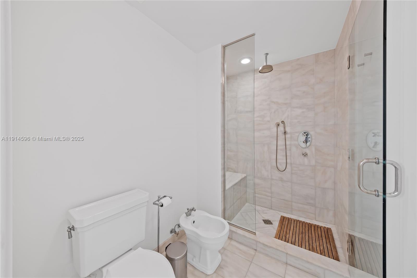 50 South Pointe Drive, Unit 1206 Miami Beach, FL 33139 - Photo 20 of 38 a bathroom with a toilet and shower