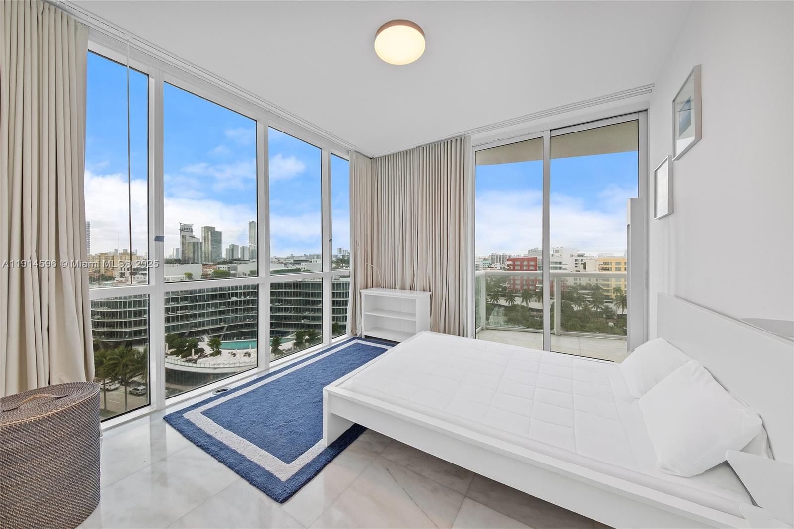 50 South Pointe Drive, Unit 1206 Miami Beach, FL 33139 - Photo 22 of 38 a room with balcony table and chairs
