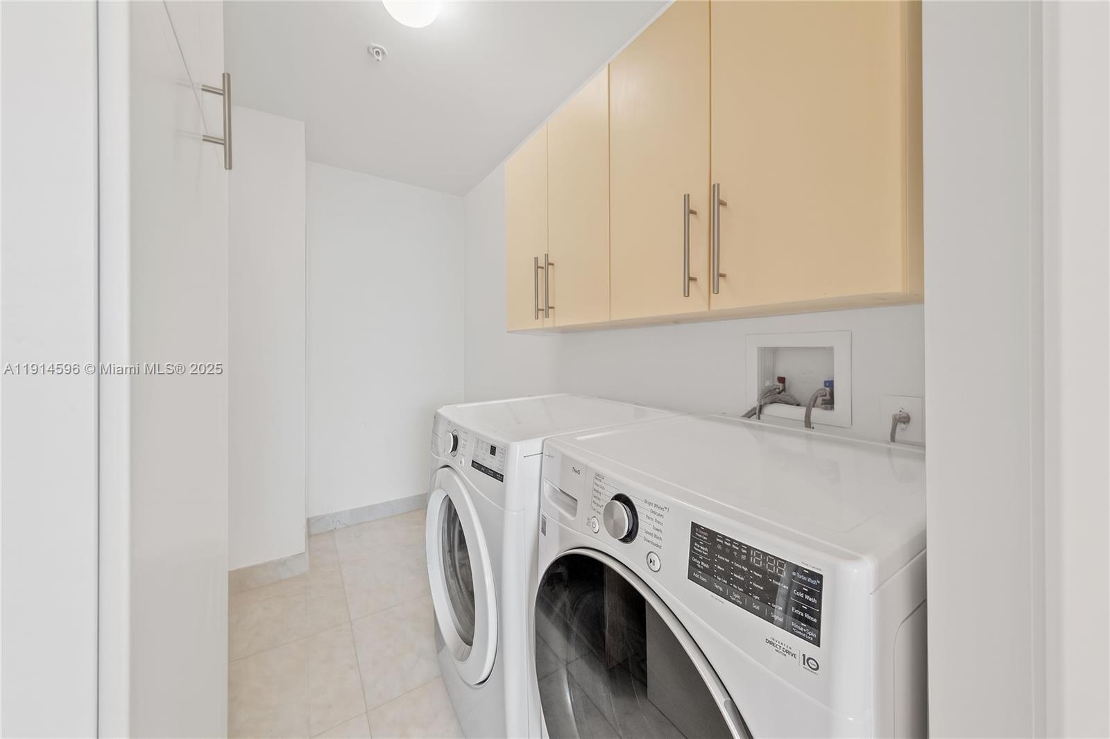 50 South Pointe Drive, Unit 1206 Miami Beach, FL 33139 - Photo 28 of 38 a utility room with dryer and washer
