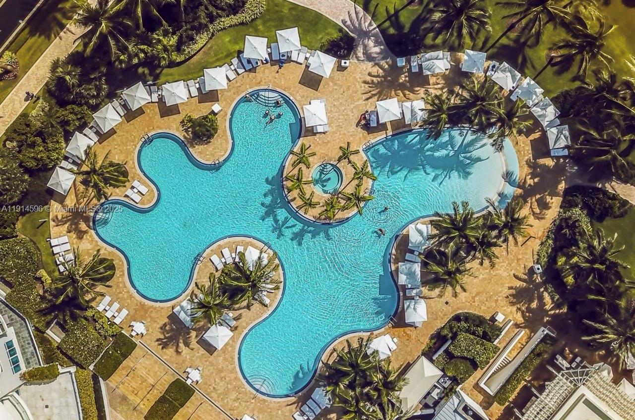 50 South Pointe Drive, Unit 1206 Miami Beach, FL 33139 - Photo 31 of 38 an aerial view of a dining table and chairs