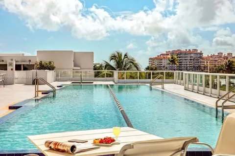 a view of swimming pool with a yard