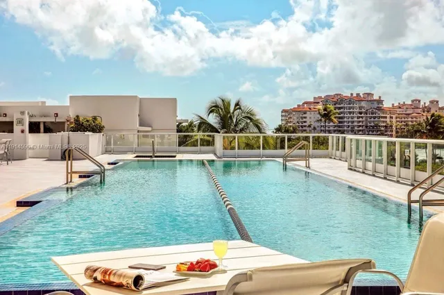 a view of swimming pool with a yard