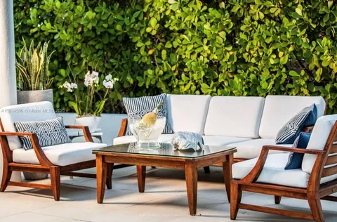 a table with chairs and a lamp on table