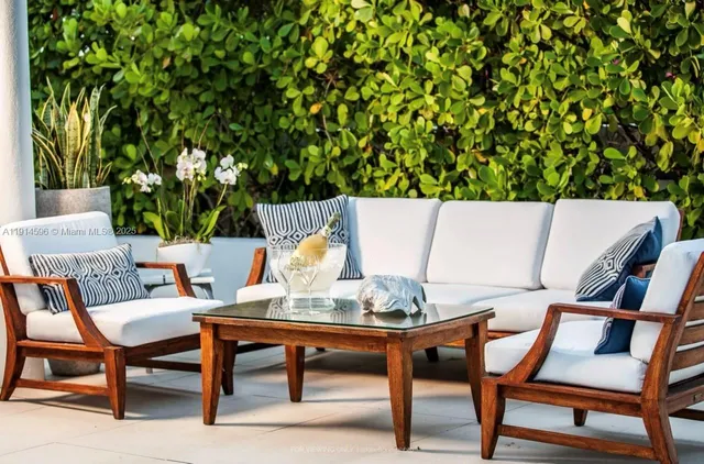 a table with chairs and a lamp on table