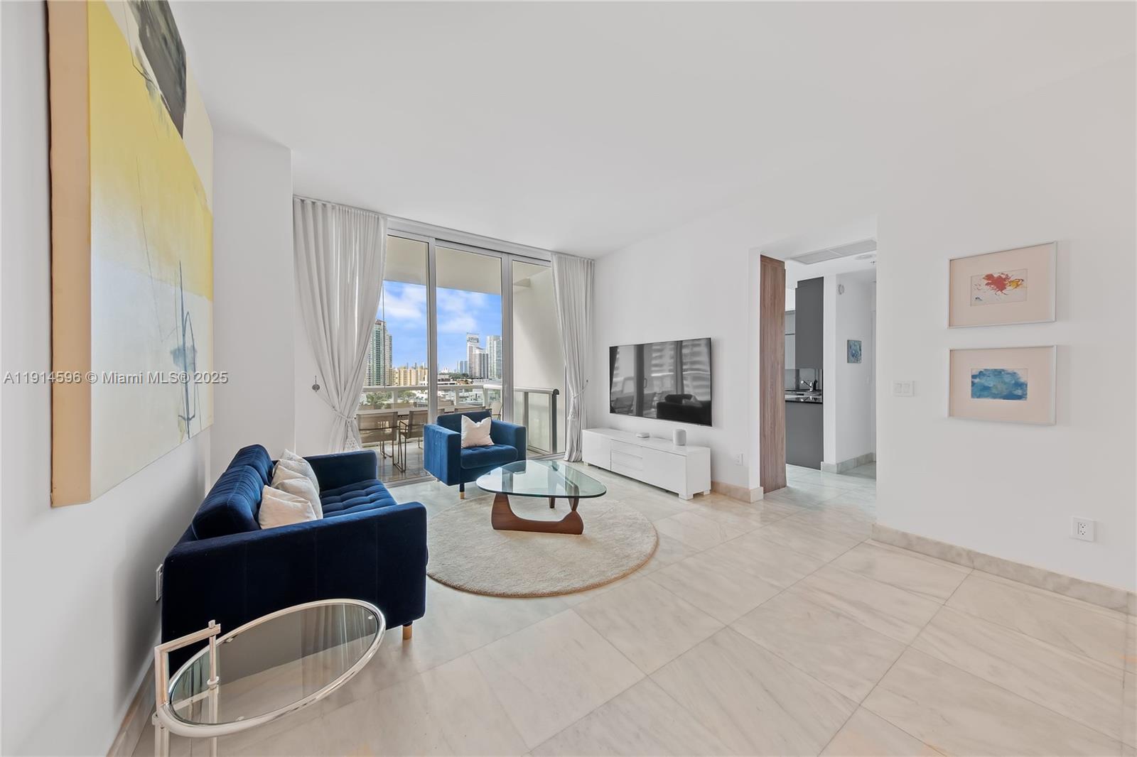 50 South Pointe Drive, Unit 1206 Miami Beach, FL 33139 - Photo 9 of 38 a living room with furniture and a window