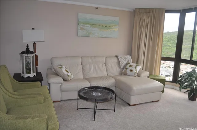 a living room with furniture and a large window