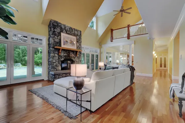 a bathroom with a sink mirror and a bathtub