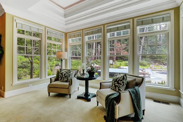 a kitchen with granite countertop a sink and a large window
