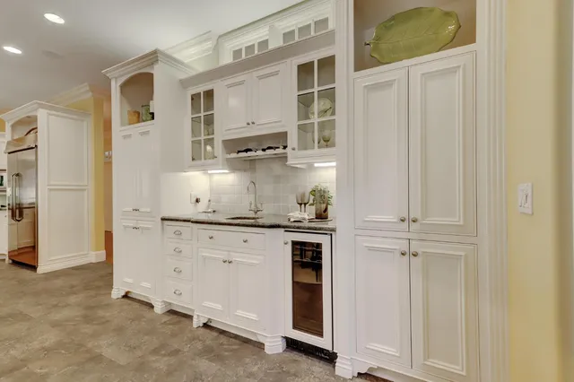 a kitchen with stainless steel appliances a stove and a refrigerator