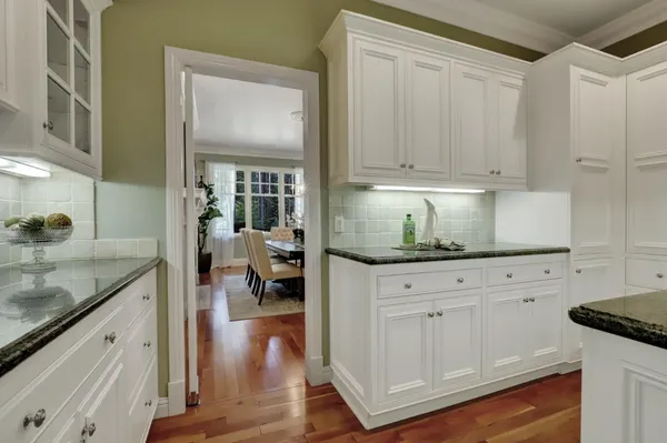 a bathroom with a sink mirror and a bathtub