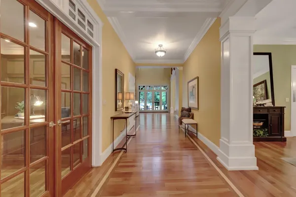 a view of a dining room with furniture and a chandelier