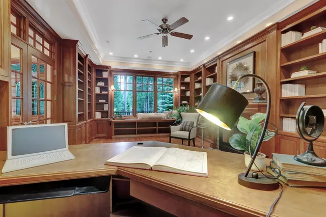 a spacious bedroom with a large bed and a fireplace