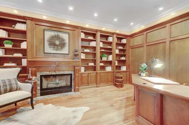 a spacious bathroom with double vanity sink a two mirror a window a bathtub and vanity