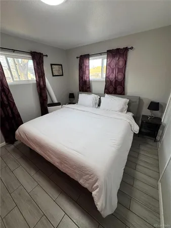 a bedroom with bed and window