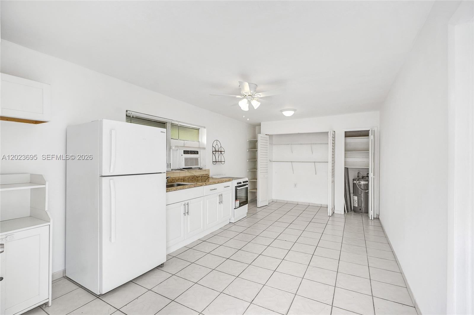 877 West 33rd Street, Unit A Hialeah, FL 33012 - Photo 19 of 36 Kitchen/Family/Dining Area